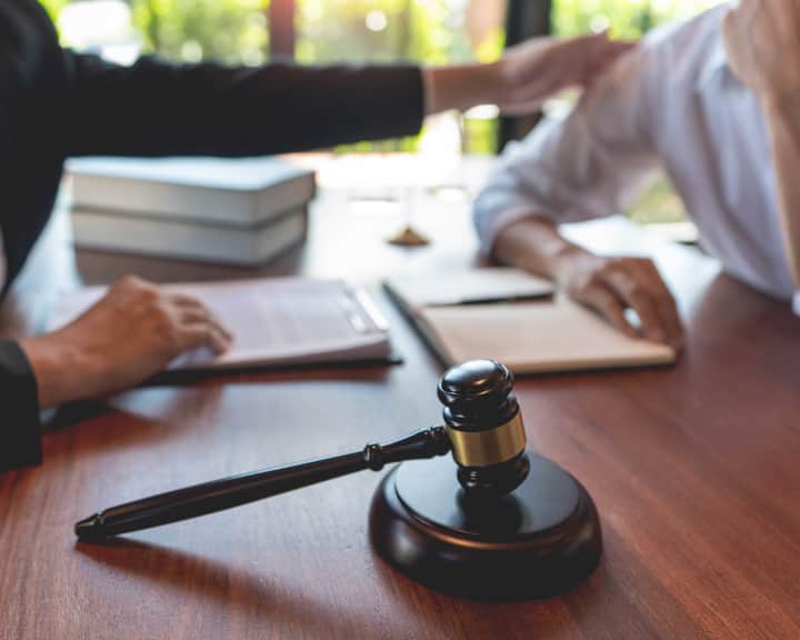 professional lawyer discussing legal options and solutions with a client in Monroe
